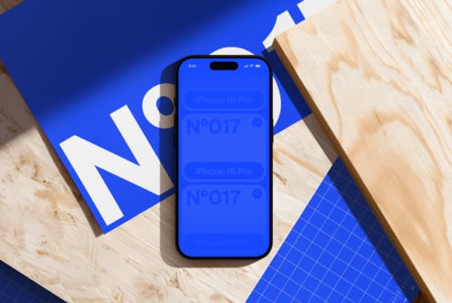 iPhone 14 Pro mockup on bright blue background with geometric design elements