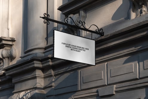 Horizontal storefront sign hanging from ornate black metal bracket on classical stone building facade