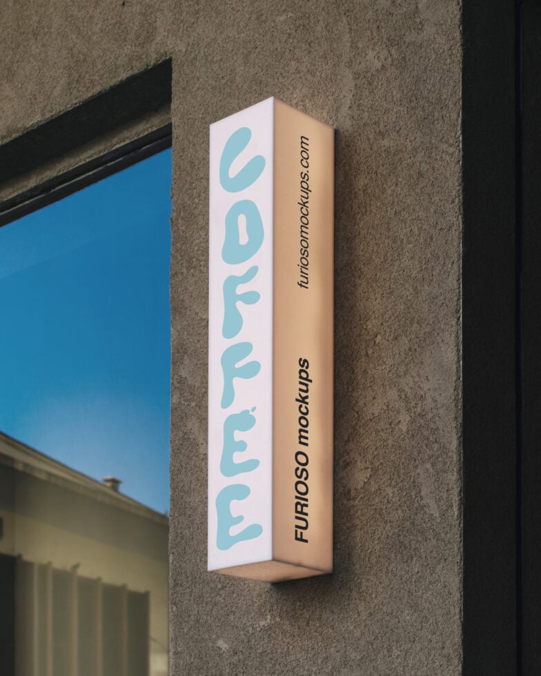 Vertical storefront sign mockup mounted on concrete wall with blue sky window reflection