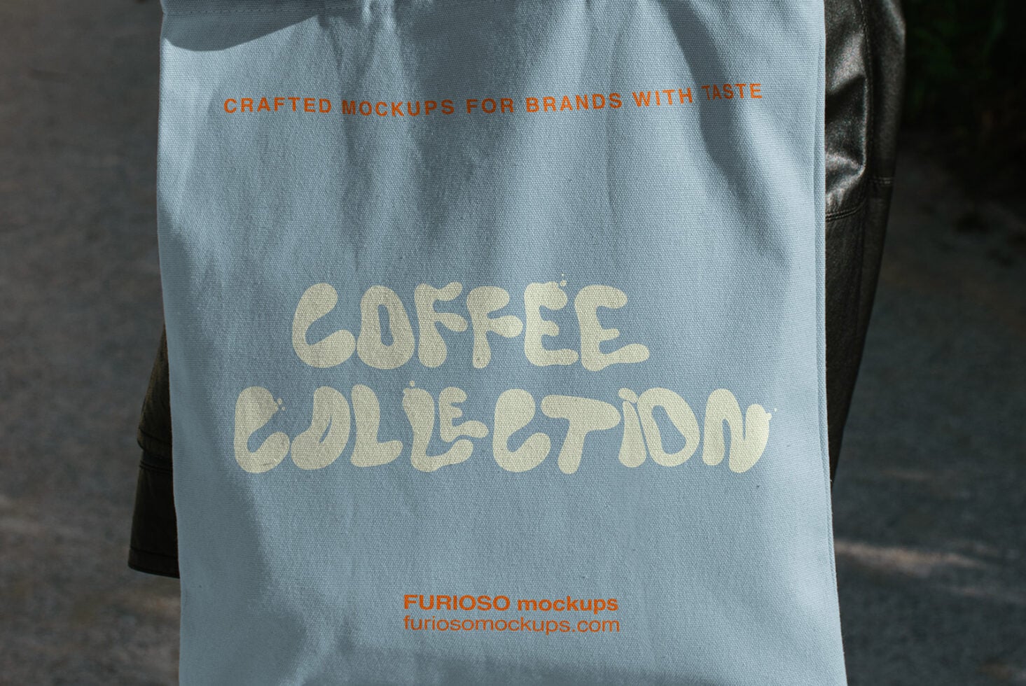 Light blue tote bag mockup with cream text reading "coffee collection" in chunky vintage lettering