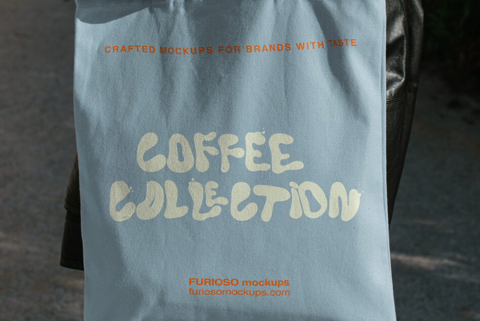 Light blue tote bag mockup with cream text reading "coffee collection" in chunky vintage lettering