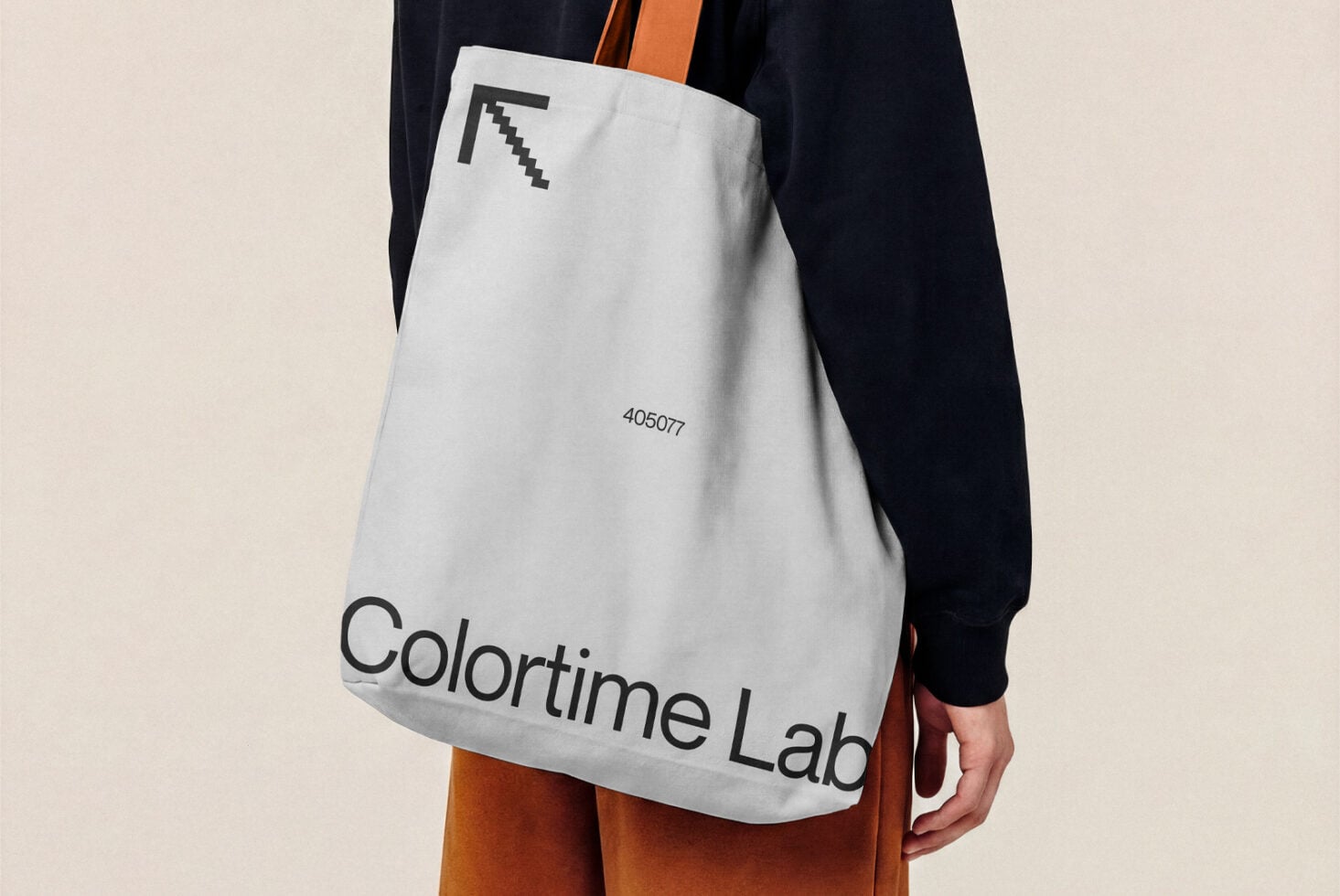 White canvas tote bag with pixel cursor icon, Colortime Lab branding, orange leather handles