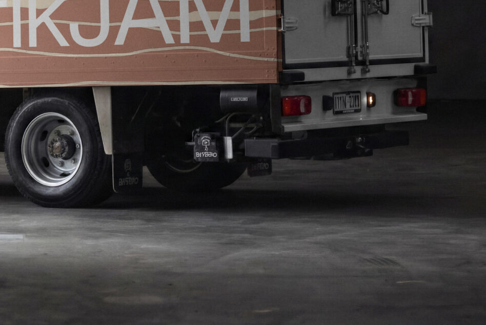 Food truck rear end detail shot with wheel, lights, hitch hardware