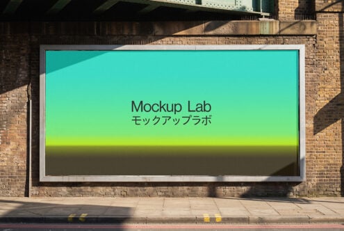 Billboard mockup on brick wall with turquoise gradient display showing text in English plus Japanese characters