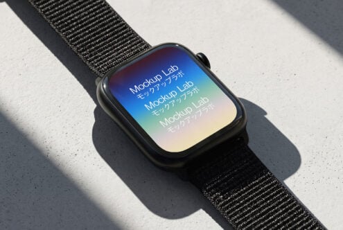 Smartwatch with black sport band on concrete, gradient screen showing colorful mockup text with natural shadow
