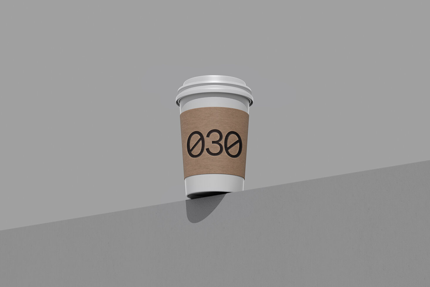 Coffee cup mockup with brown kraft sleeve showing 030 number on gray surface