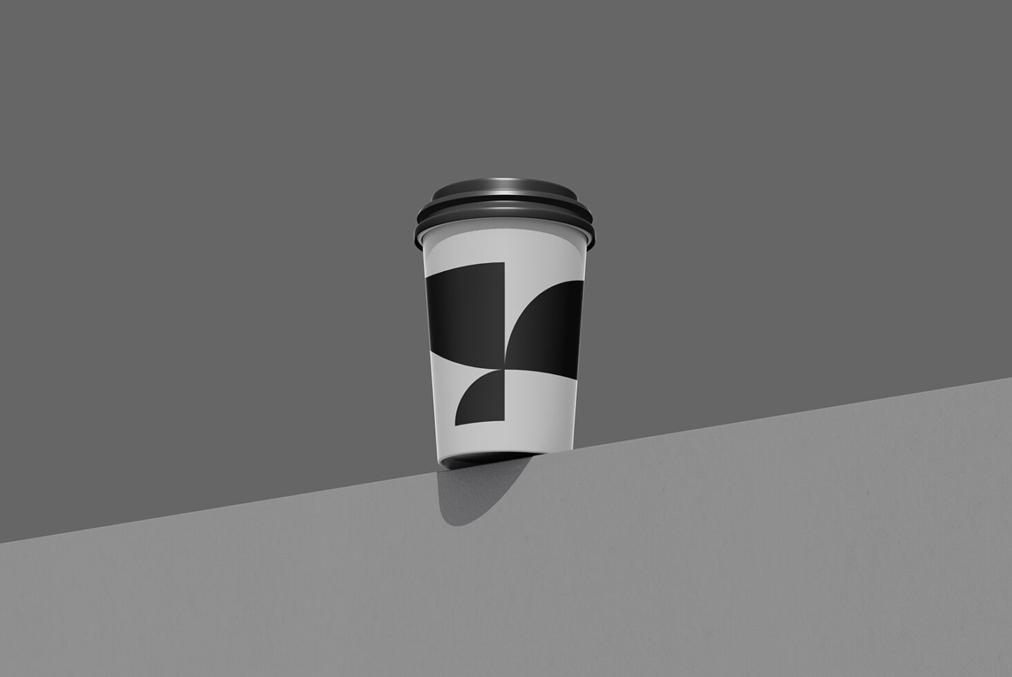 Coffee cup mockup with geometric black circle design on white sleeve