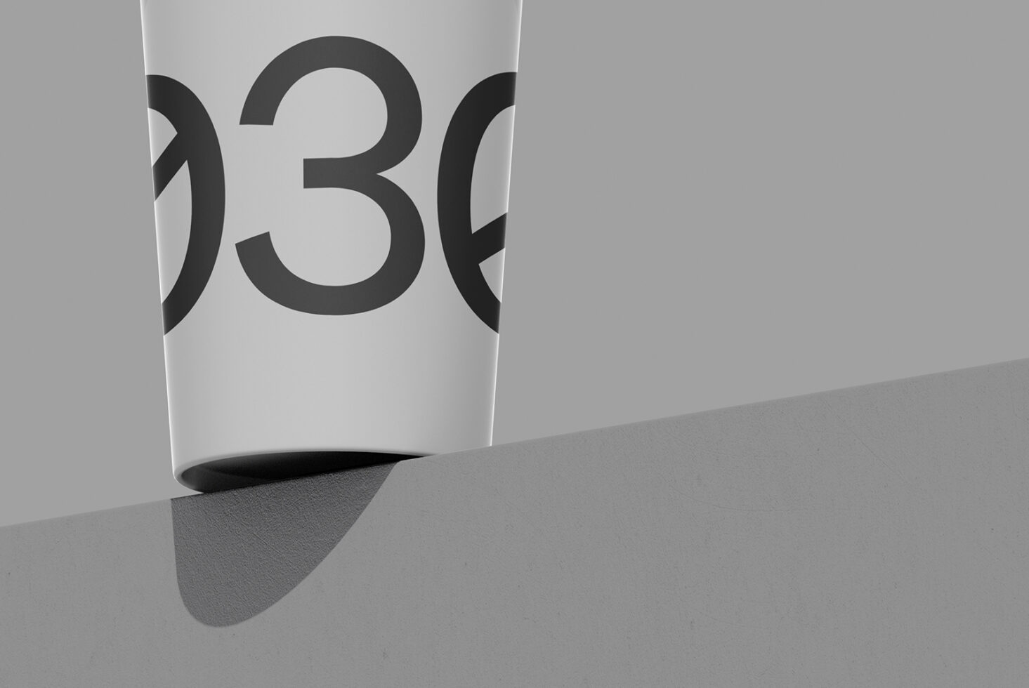 White cup mockup with bold number 30 printed on side, angled view