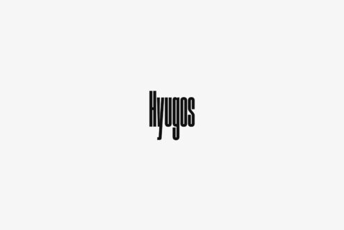 Bold striped typeface logo centered on light gray background