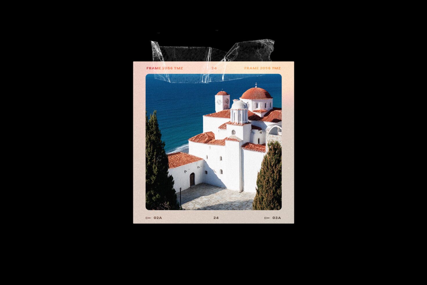 Vintage film slide of white Greek church with terracotta domes overlooking blue water