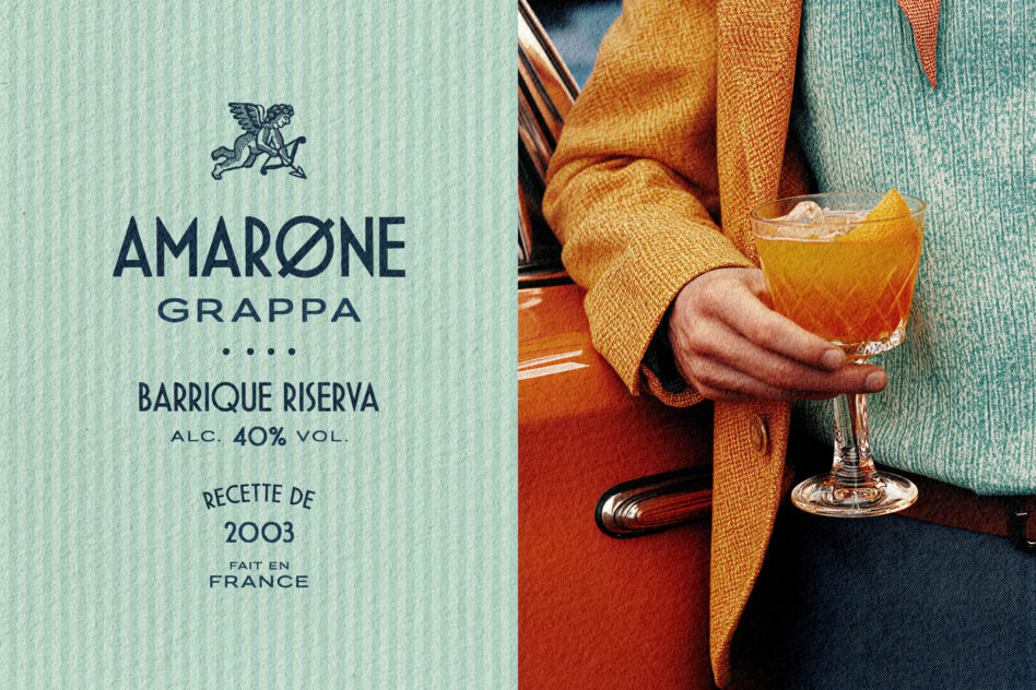 Luxury grappa bottle label with vintage aesthetic next to styled cocktail in warm tones