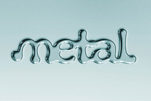 Shiny chrome neon tube spelling out metal against soft blue background