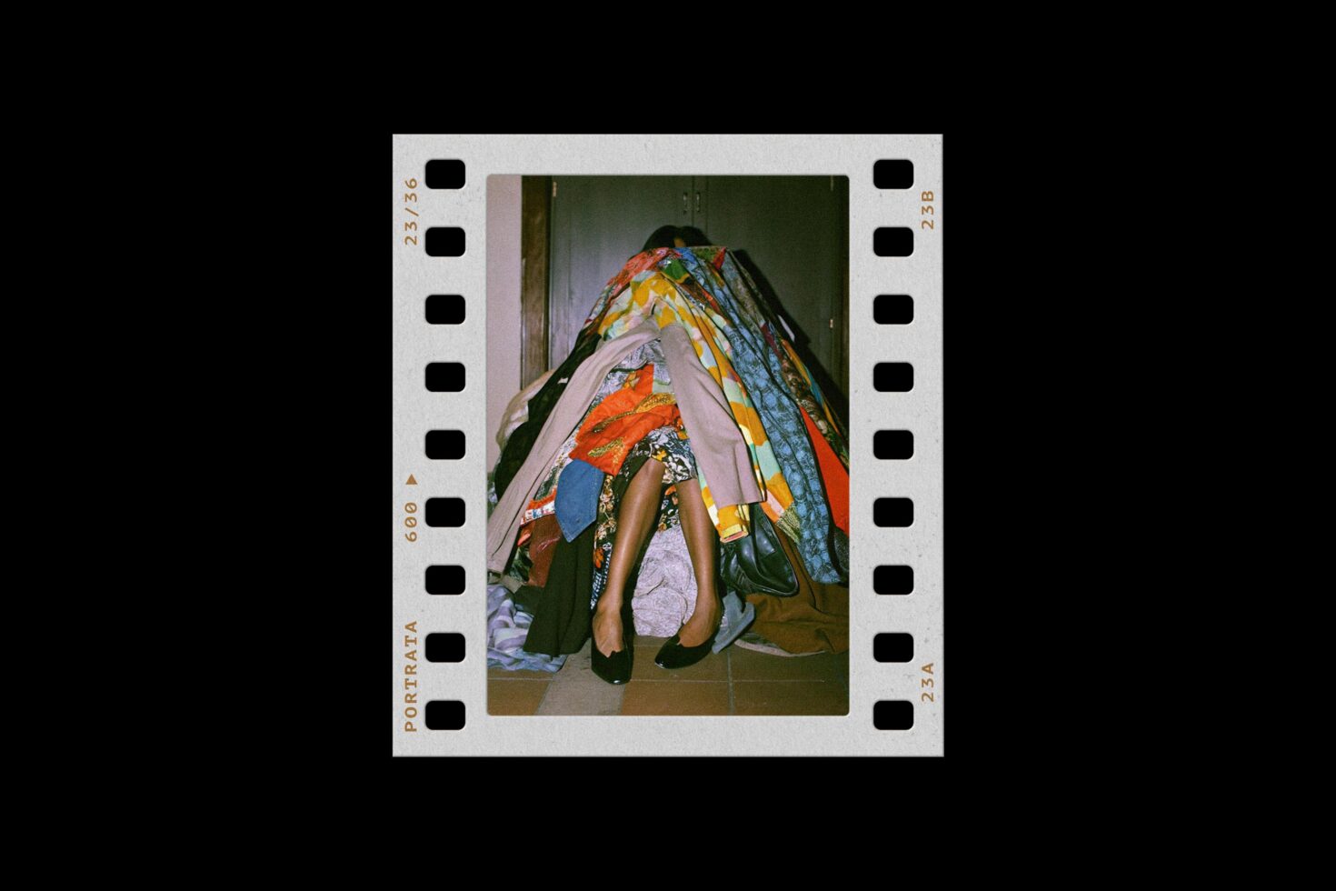 Film strip mockup with colorful fabric pile, legs in heels, vintage photography aesthetic