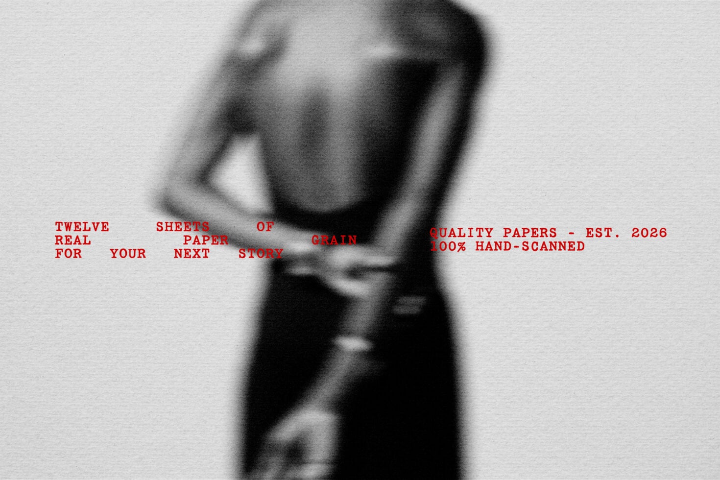 Blurred black-and-white photo of person holding papers with red typewriter text overlay about quality grain stock