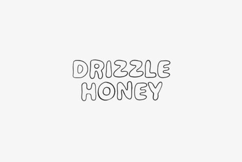 Drizzle Honey outline font in playful bubbly style on cream background