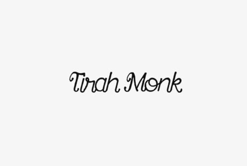 Tirah Monk handwritten script font in black italic style on light background