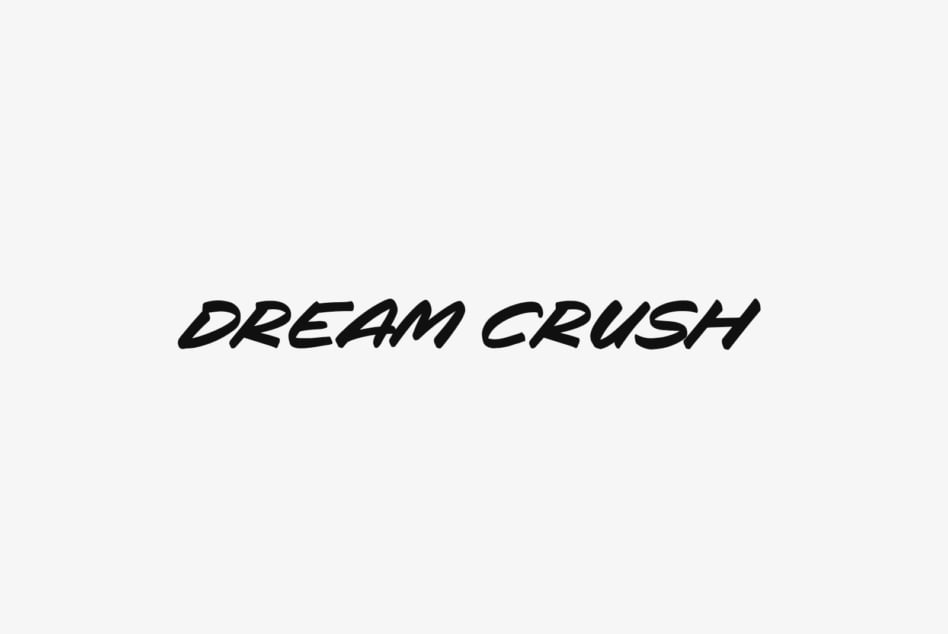 Bold italic typography reading "Dream Crush" centered on light gray background