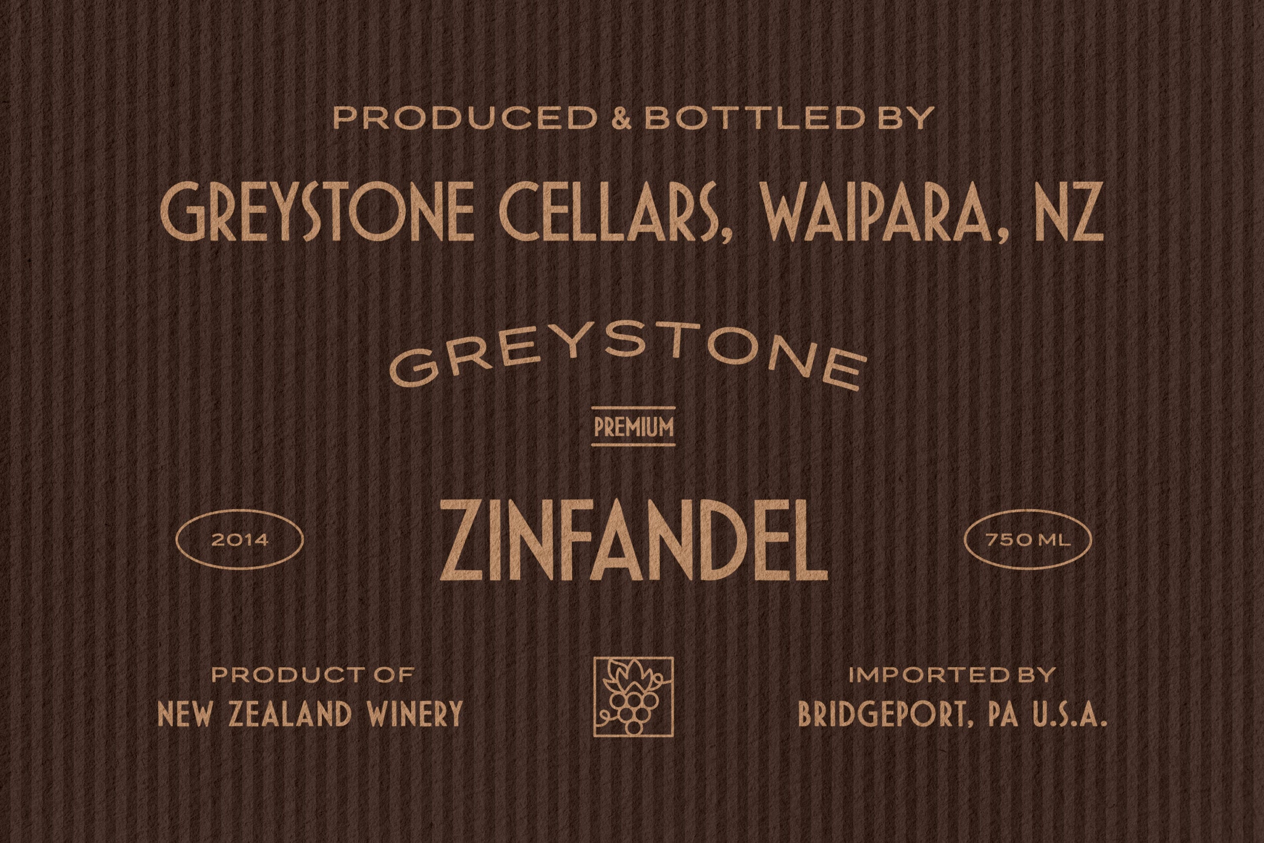 Wine label mockup showing gold text on dark wood grain texture for Greystone Zinfandel