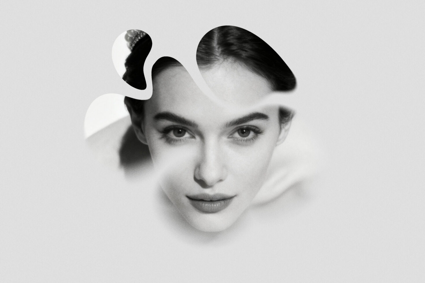 Surreal black-and-white portrait with layered faces, dreamy overlapping effect, vintage editorial vibes