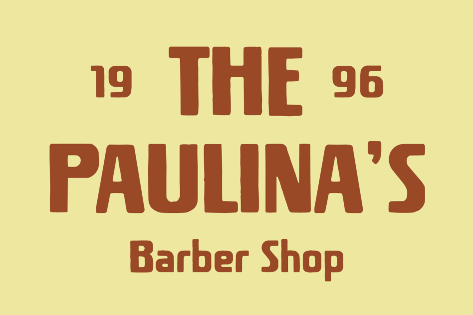 Retro barber shop sign with rust brown type on pale yellow background