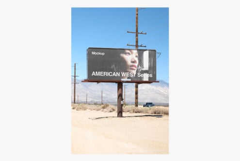 Vintage desert billboard mockup with woman's face, mountains in background