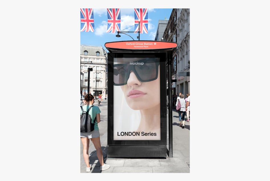 Street level advertising mockup showing bus shelter display at Oxford Circus London station with Union Jack flags