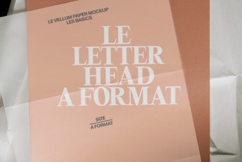 Soft peachy letterhead mockup showing A4 format with serif typography on textured paper background