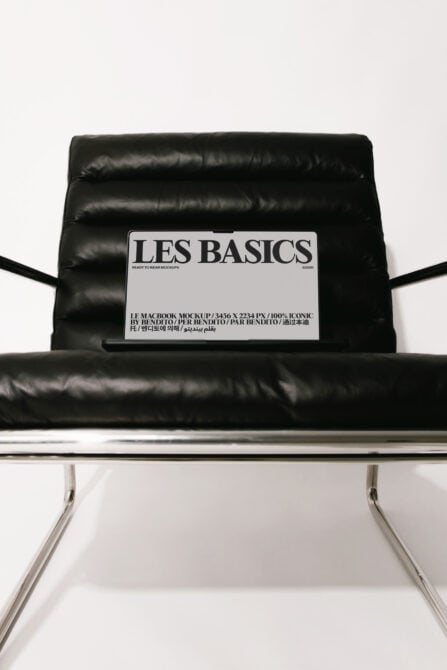 Laptop mockup on black puffy chair with Les Basics label showing design space
