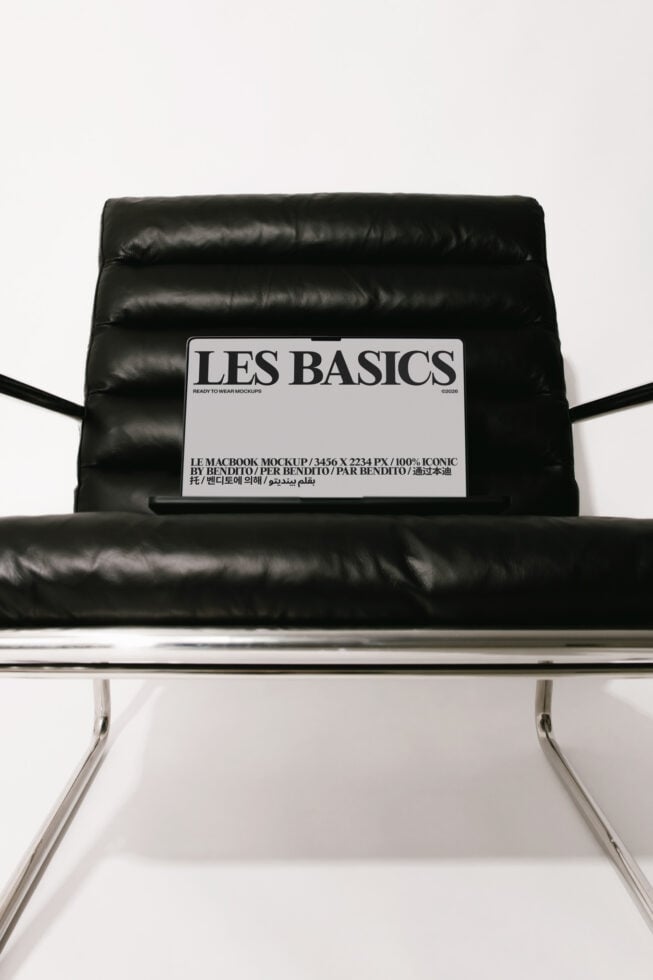 Laptop mockup on black puffy chair with Les Basics label showing design space