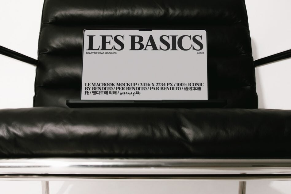 Les Basics MacBook mockup on black puffer jacket with multilingual label details