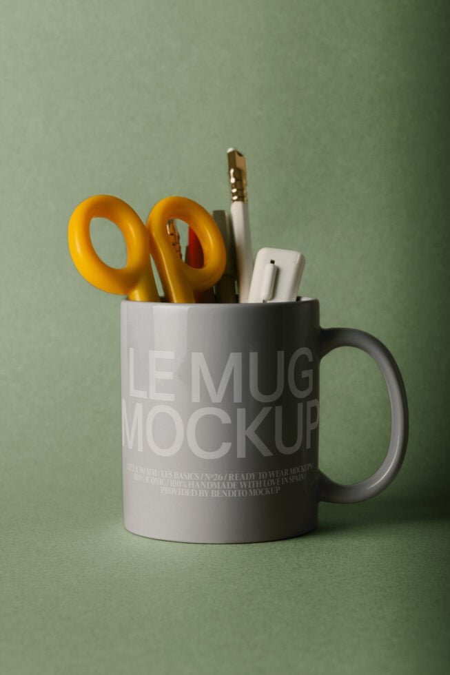 Ceramic mug mockup with gold scissors, brushes, pen in sage green setting