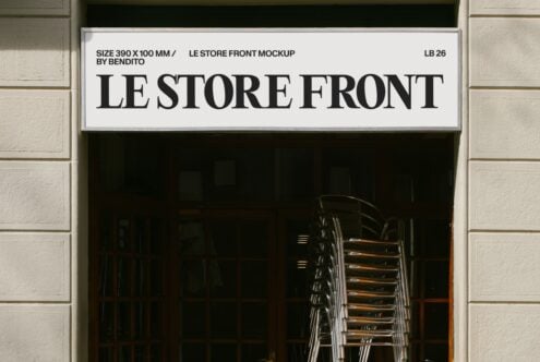 Minimal storefront sign mockup with bold serif lettering on cream background, stacked chairs visible through dark window below