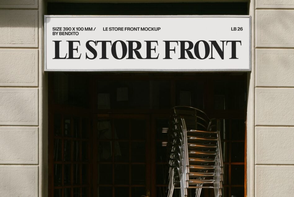Minimal storefront sign mockup with bold serif lettering on cream background, stacked chairs visible through dark window below