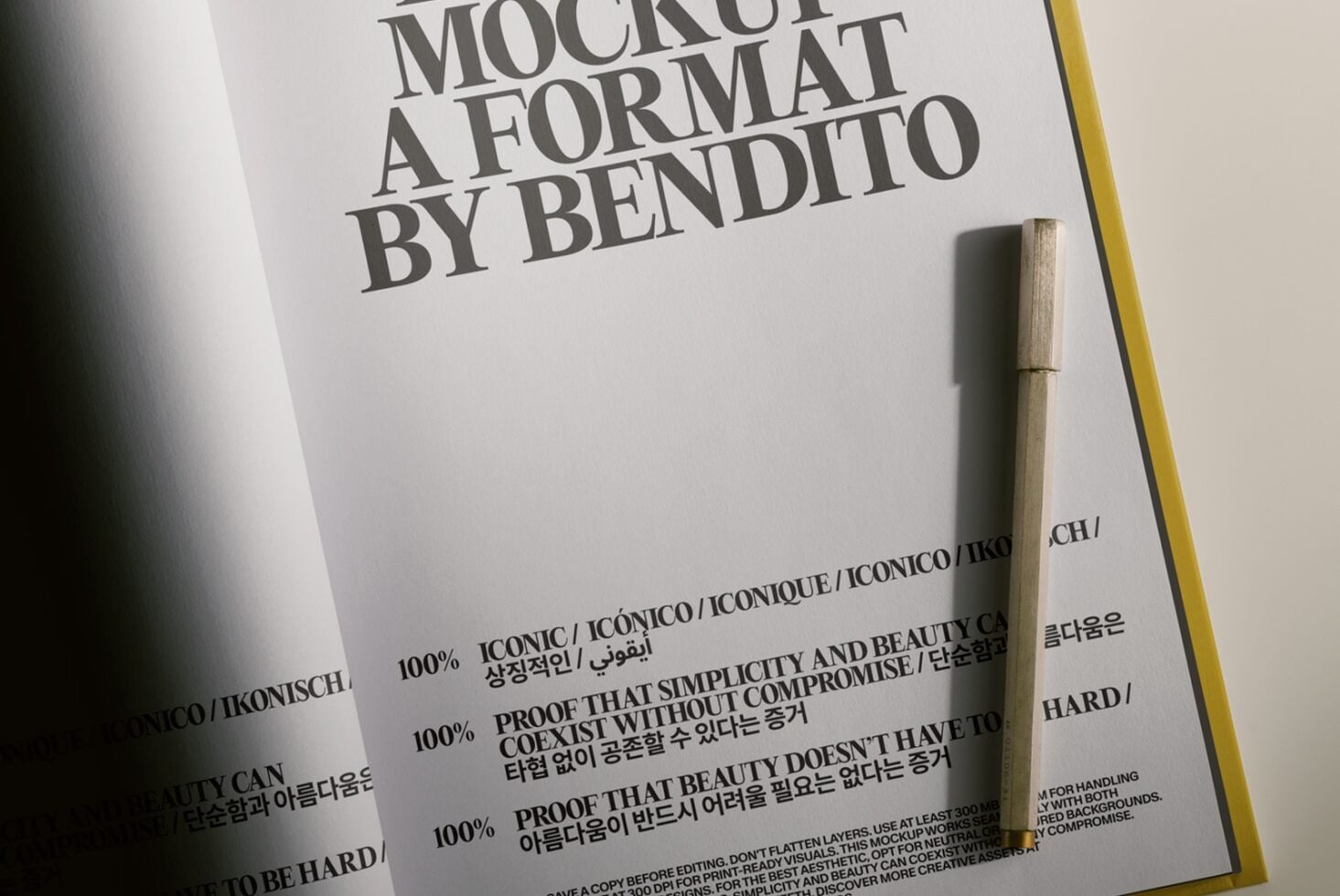 Minimalist book cover mockup with serif typography, wooden pen, multilingual text on cream paper with yellow spine edge