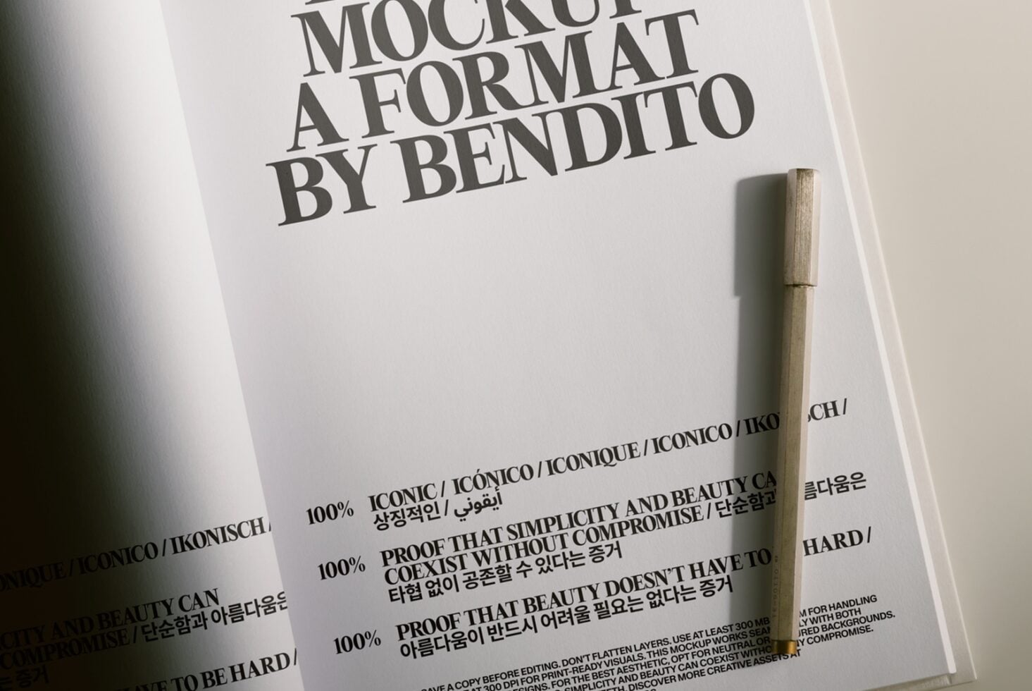 Oversized typography on white paper with wooden pen, Bendito mockup design template