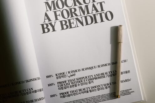 Oversized typography on white paper with wooden pen, Bendito mockup design template