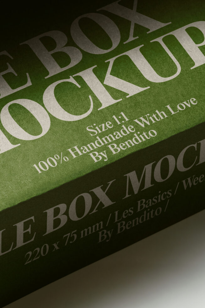 Stacked green boxes with embossed serif lettering showing handmade product packaging mockup details
