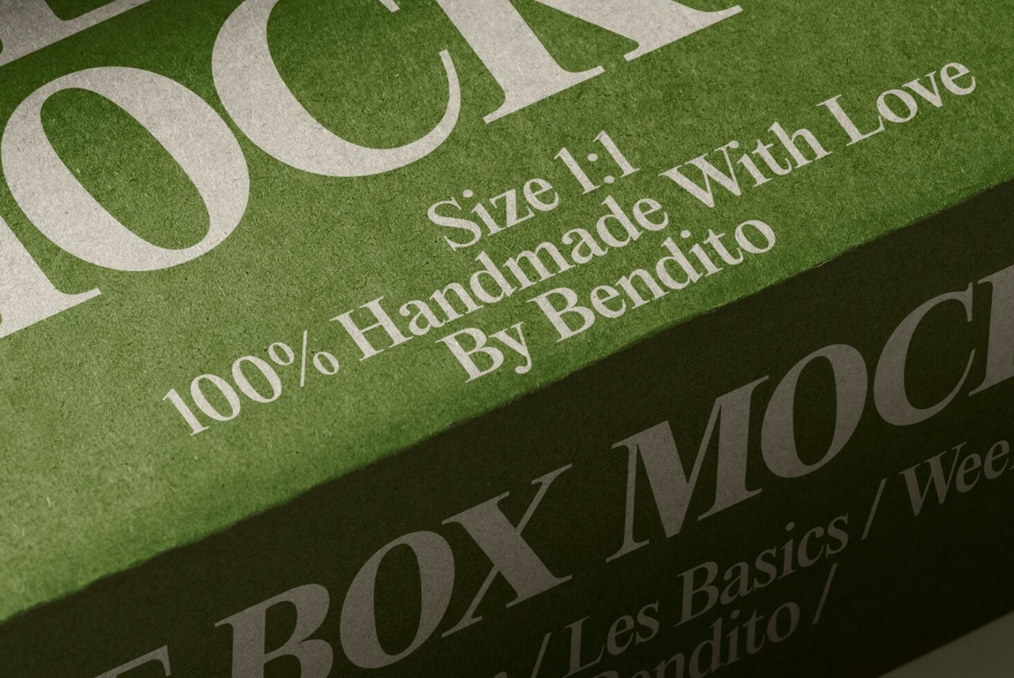 Close-up of green box with cream serif typography showing handmade product details