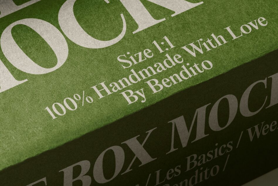 Close-up of green box with cream serif typography showing handmade product details