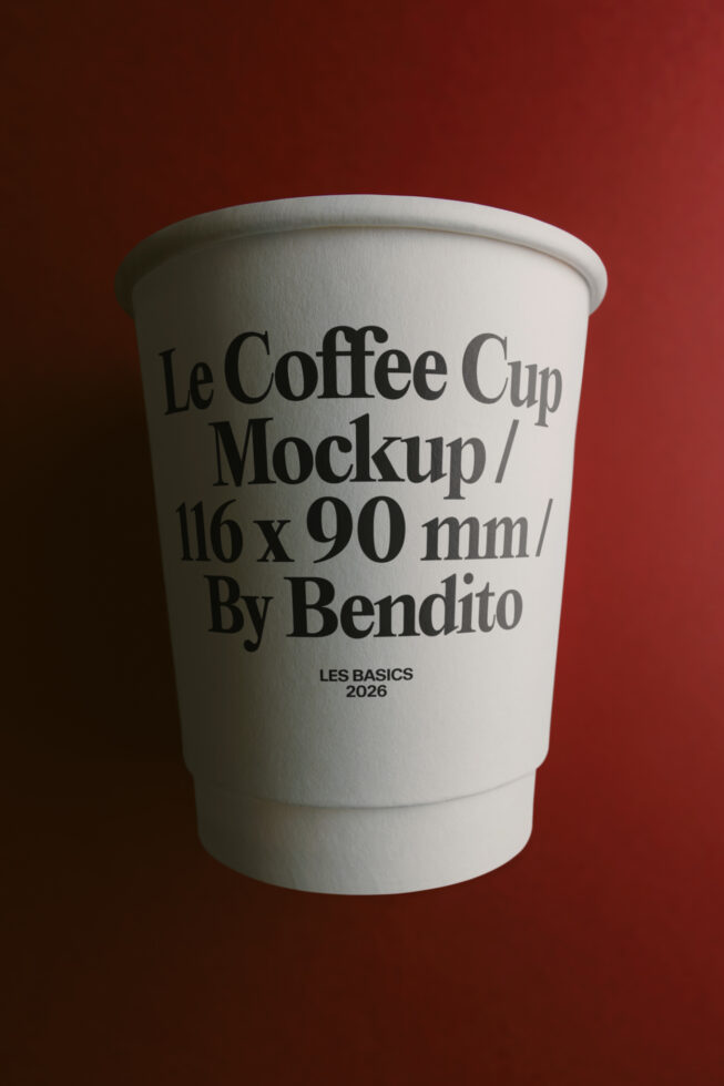 White takeout coffee cup with serif typography on deep red background