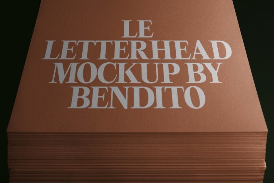 Stacked letterhead mockup with embossed silver serif text on terracotta cardstock