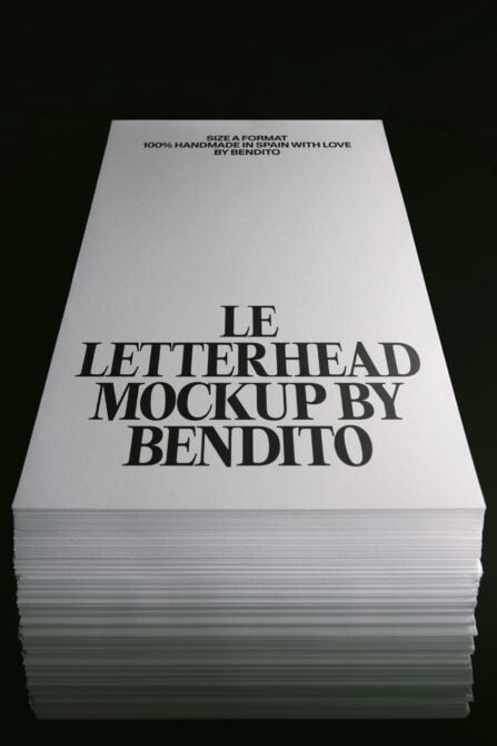 Stacked letterhead sheets showing serif typography layout on white paper with dark background