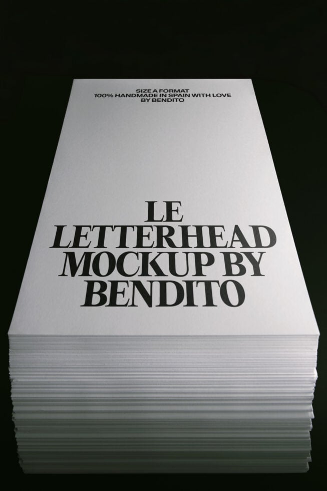 Stacked letterhead sheets showing serif typography layout on white paper with dark background