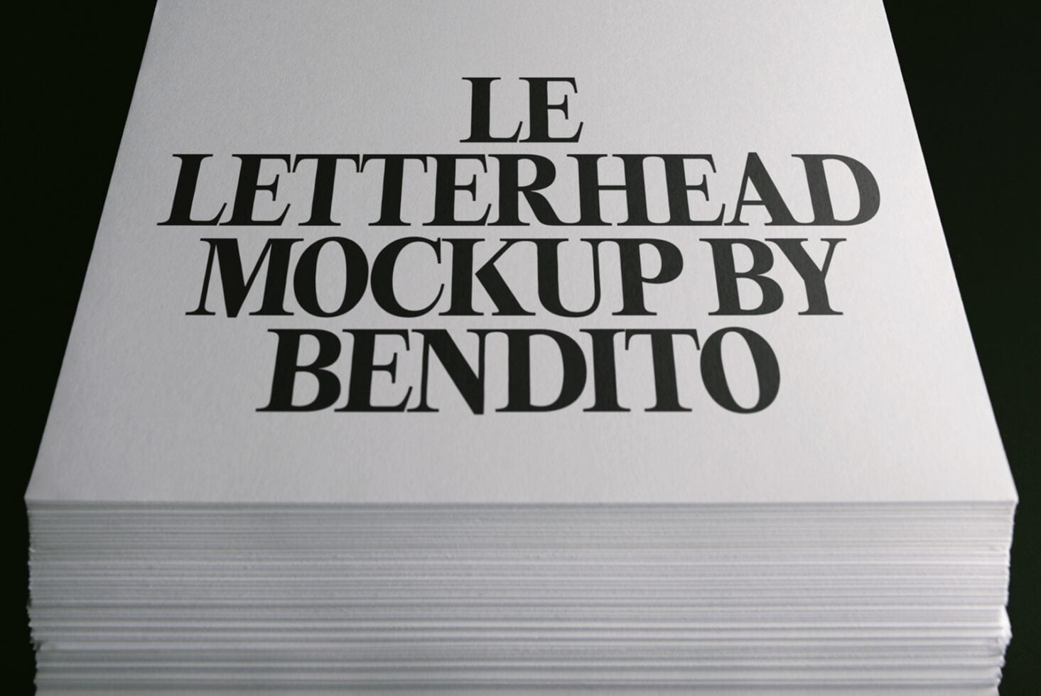 Stack of white letterhead sheets with serif typography showing "LE LETTERHEAD MOCKUP BY BENDITO"