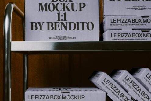 Pizza box mockup staged on wooden shelf with metal rail, stacked boxes showing branding from Bendito