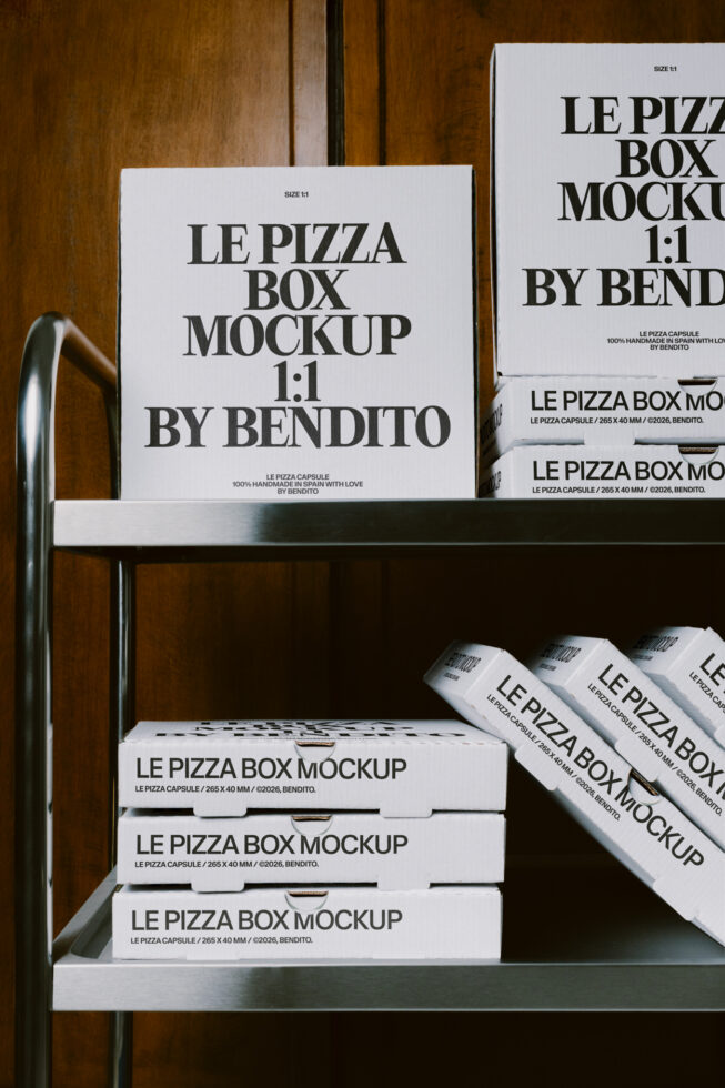 Styled pizza box mockup display on wooden shelves showing 1:1 square format boxes with bold serif typography