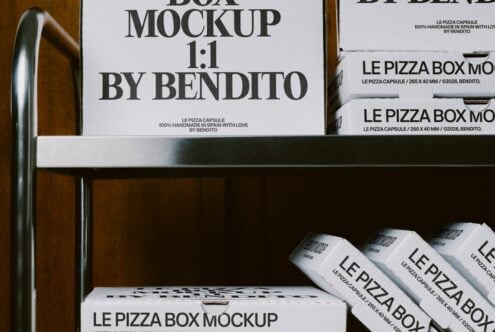 Square pizza box mockup displayed on wooden shelves with stacked packaging