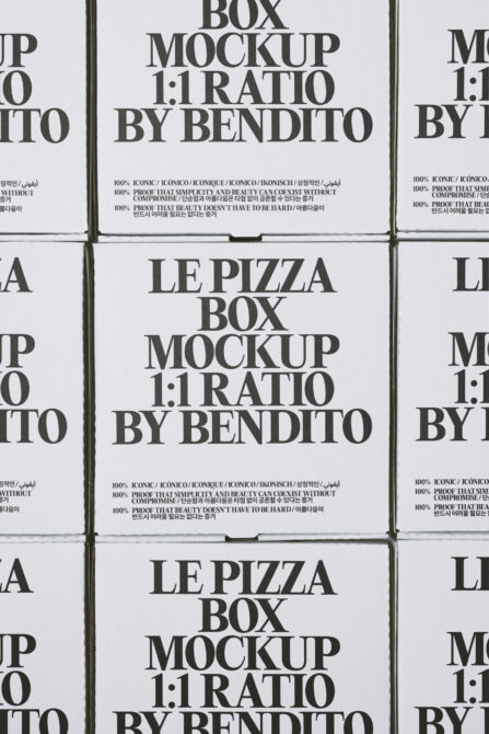 Square pizza box mockup with 1:1 ratio showing serif typography on white cardboard with multilingual text
