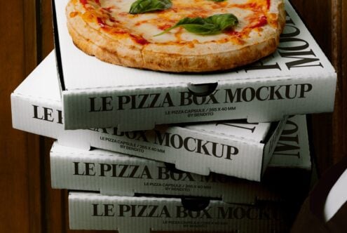 Stacked pizza boxes with fresh margherita on top, Le Pizza Box Mockup by Bendito