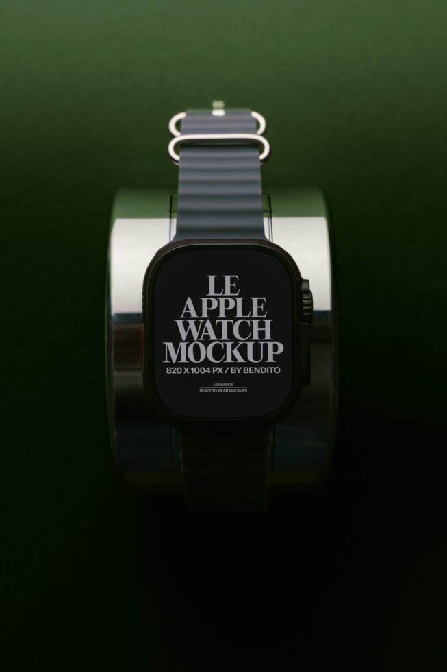 Black Apple Watch with grey sport band on green background with product display stand